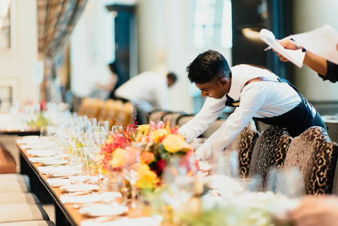 Warm hospitality table setting representing thoughtful event hosting