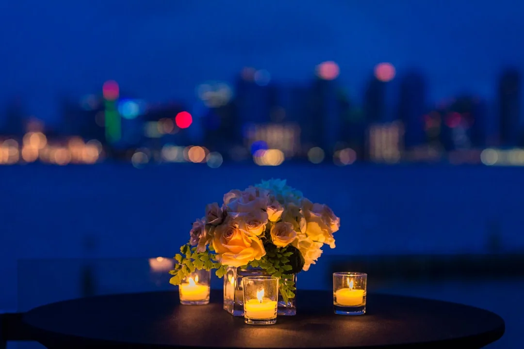 Elegantly lit event table with candlelight — premium hospitality atmosphere