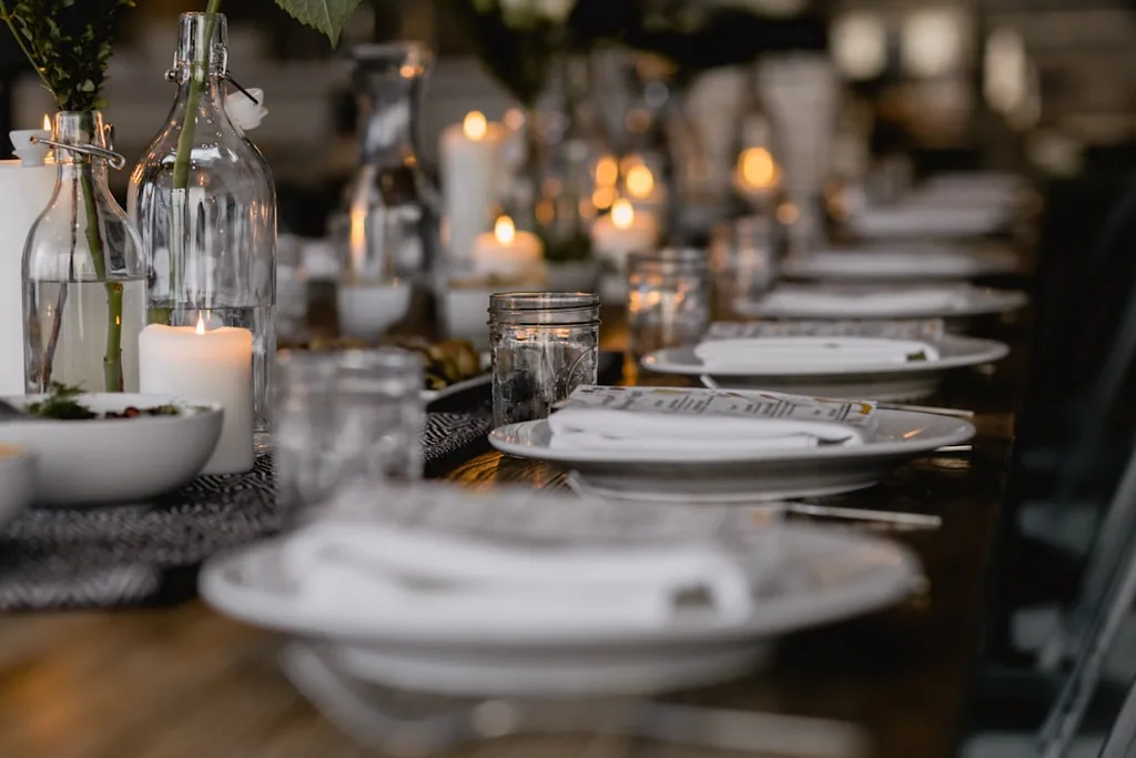 Candlelit event table showing warm hospitality atmosphere