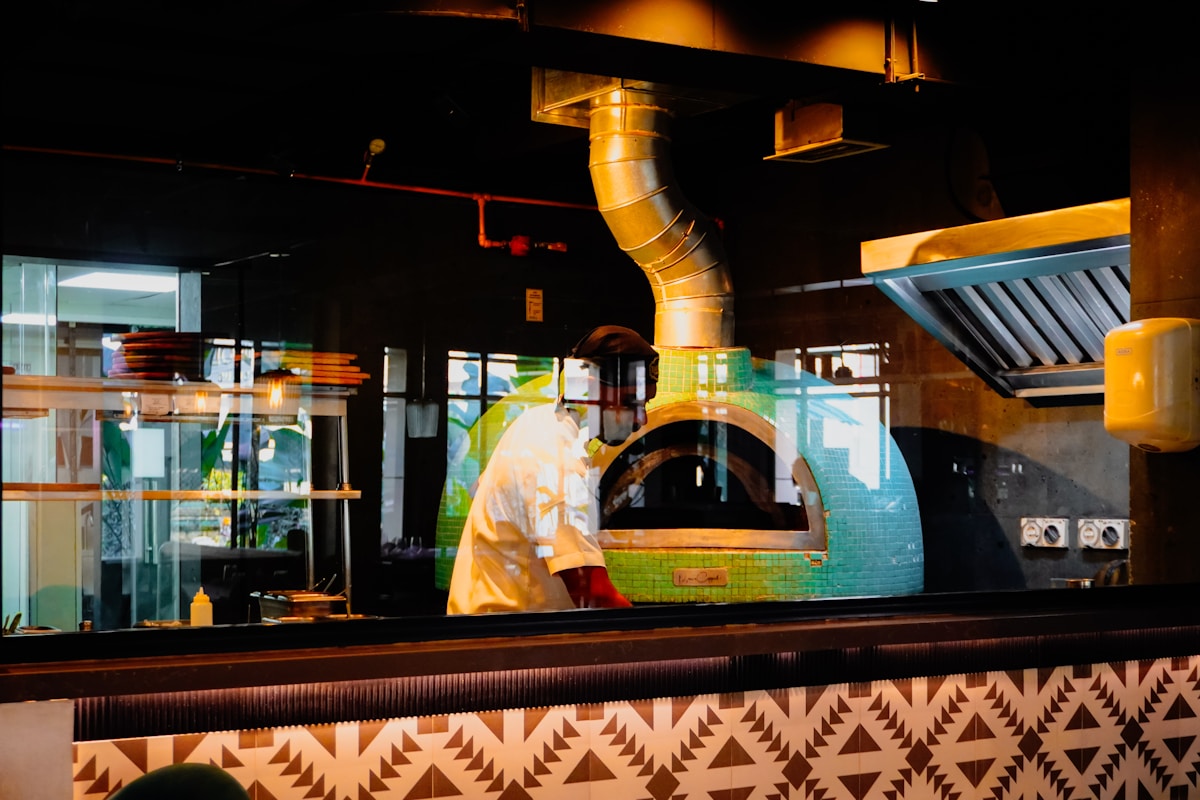 Professional kitchen with chef cooking